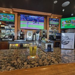 High Five Pizza - Middle of the bar, tv selection on point.