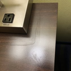 Sticky substance on table, you can see where they just smeared it around the lamp