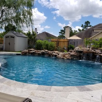 Triton Pools - a large pool with a waterfall - General Contractors Near Me - Cypress, Texas