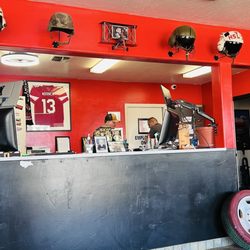 Tire Pro Automotive - Service counter, note the helmets on the wall above!