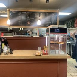 a woman standing at the counter a woman standing at the counter