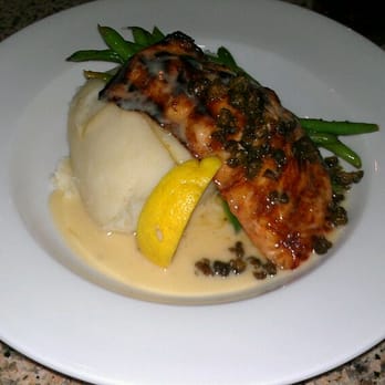 The Mansion - Salmon w/ capers and lemon sauce - New American Near Me - Melbourne, Florida The Mansion - Salmon w/ capers and lemon sauce - New American Near Me - Melbourne, Florida