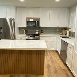 The One Renovation - Kitchen remodel: We took a U shaped kitchen removed a wall and relocated sink, oven and refrigerator.
