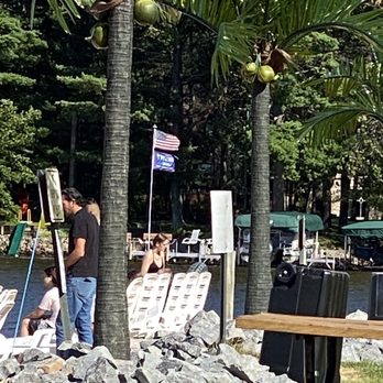 Tiki Beach Bar & Grill - a man painting on the beach - American Near Me - Mosinee, Wisconsin