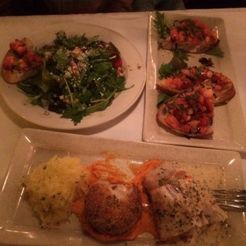 Noosa Bistro - Noosa Bistro.  Striped bass w spaghetti squash, risotto cake on carrot puree, and Noosa salad and bruschetta. - Seafood Near Me - Mentor, Ohio