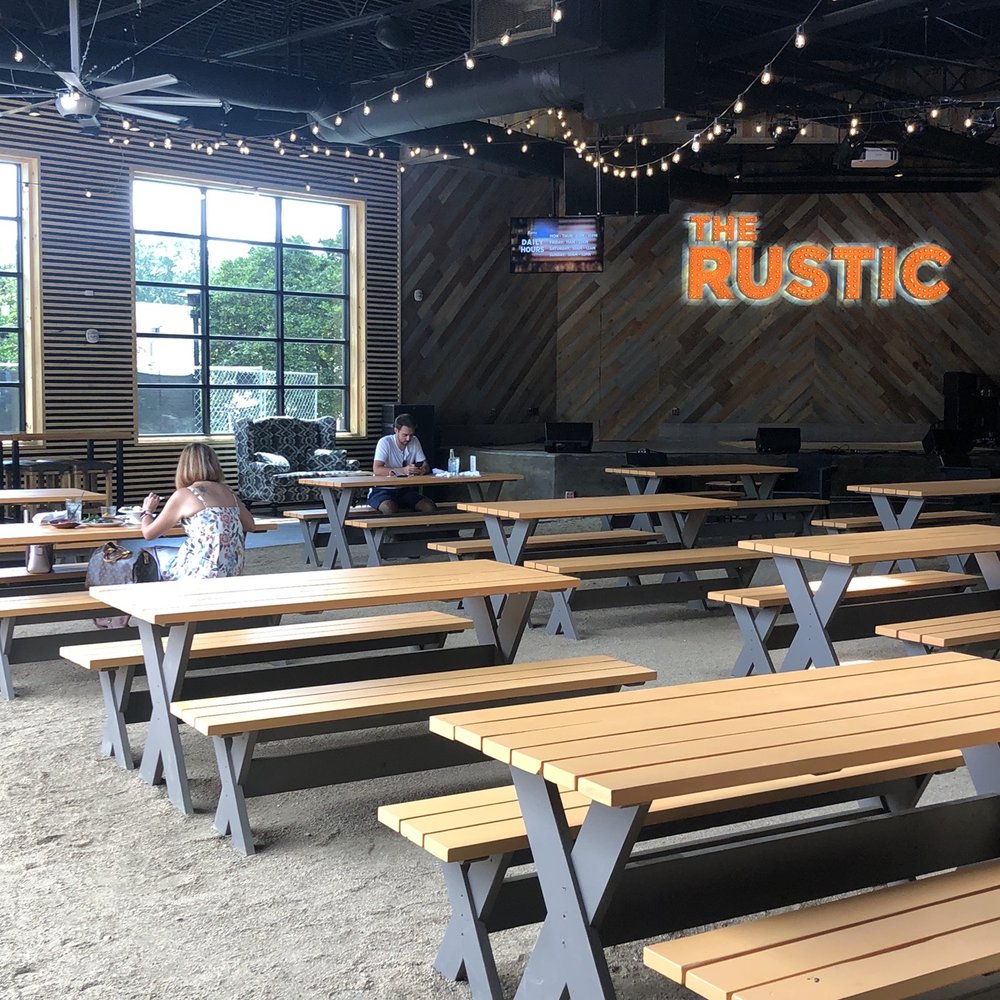 The Rustic - Love the outside is inside picnic table area around the music stage - Venues & Event Spaces Near Me - Houston, Texas The Rustic - Love the outside is inside picnic table area around the music stage - Venues & Event Spaces Near Me - Houston, Texas