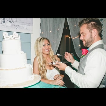 It's All About The Cake - Josh and Sarah cutting the cake! - Bakeries Near Me - Dana Point, California It's All About The Cake - Josh and Sarah cutting the cake! - Bakeries Near Me - Dana Point, California