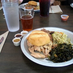 12 Bones Smokehouse RIVER - A pulled chicken sandwich with sides.