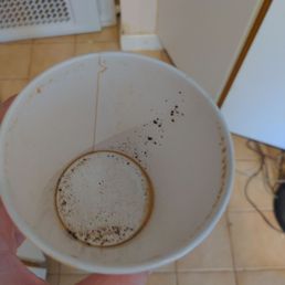 Coffee cup with tons of grounds at bottom Coffee cup with tons of grounds at bottom