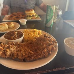 Chicken fried steak, baked beans, Mac n cheese and my wine in a champagne glass