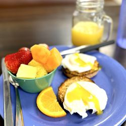 Maggie Mae's on the Bluffs - 2 Poached Eggs served on an English Muffin with Fresh Fruit