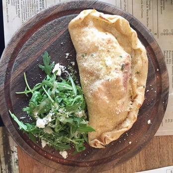 Il Pirata - Calzone on wood - Italian Near Me - Belfast, BFS Il Pirata - Calzone on wood - Italian Near Me - Belfast, BFS