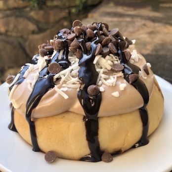 Cinnaholic - a chocolate covered donut on a plate - Bakeries Near Me - Ankeny, Iowa Cinnaholic - a chocolate covered donut on a plate - Bakeries Near Me - Ankeny, Iowa