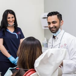 Braydon Dental Care - Dr. Manny & his assistant going over a procedure with a patient