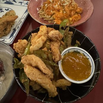 Phoenix Palace - Salt & Pepper Cuttlefish (front) and Chili Crab Noodles (back) - Cantonese Near Me - New York, New York Phoenix Palace - Salt & Pepper Cuttlefish (front) and Chili Crab Noodles (back) - Cantonese Near Me - New York, New York