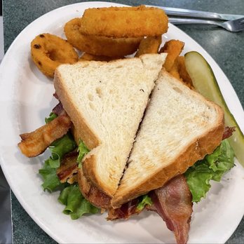 Metro Diner - Double Decker BLT with onion rings and a deli pickle. - American Near Me - Altamonte Springs, Florida Metro Diner - Double Decker BLT with onion rings and a deli pickle. - American Near Me - Altamonte Springs, Florida