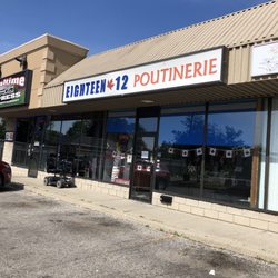 Eighteen12 Poutinery - Store front. It's behind the gas station.