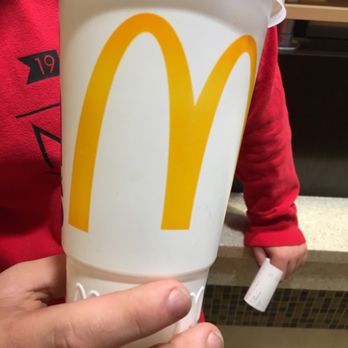 McDonald's - a person holding a cup of coffee - Burgers Near Me - Holland, Ohio McDonald's - a person holding a cup of coffee - Burgers Near Me - Holland, Ohio