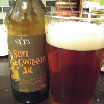 Northumberland Hills Brewery - a glass of beer next to a bottle of super continental ale - Breweries Near Me - Cobourg, Ontario