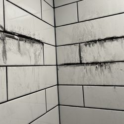 Prestige Grout, Marble & Granite - Bleeding / Dissolving black grout installed incorrectly.