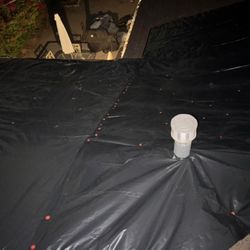 UV Roofing - Same-day emergency tarp installation completed before the rain -- secured around vents and fastened clean for temporary protection.