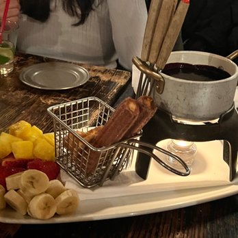 Chimayo - Dessert fondu with fruit, sweets and chocolate sauce - New American Near Me - Park City, Utah Chimayo - Dessert fondu with fruit, sweets and chocolate sauce - New American Near Me - Park City, Utah