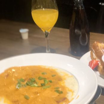 Famous Toastery - Shrimp & Grits with Man-Mimosas - Breakfast & Brunch Near Me - Charlotte, North Carolina Famous Toastery - Shrimp & Grits with Man-Mimosas - Breakfast & Brunch Near Me - Charlotte, North Carolina