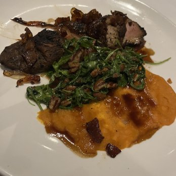 Table 100 - Delightful Duck entree with a side of sweet potato - New American Near Me - Flowood, Mississippi