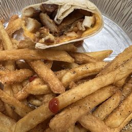 This is what you get when you order the chicken wrap Dry overcooked burned chicken with a side of old hard fries. This is what you get when you order the chicken wrap Dry overcooked burned chicken with a side of old hard fries.