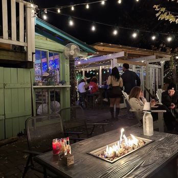 Southern Crescent Galley and Bar - Fire table and back bar area - Cajun/Creole Near Me - Charlottesville, Virginia