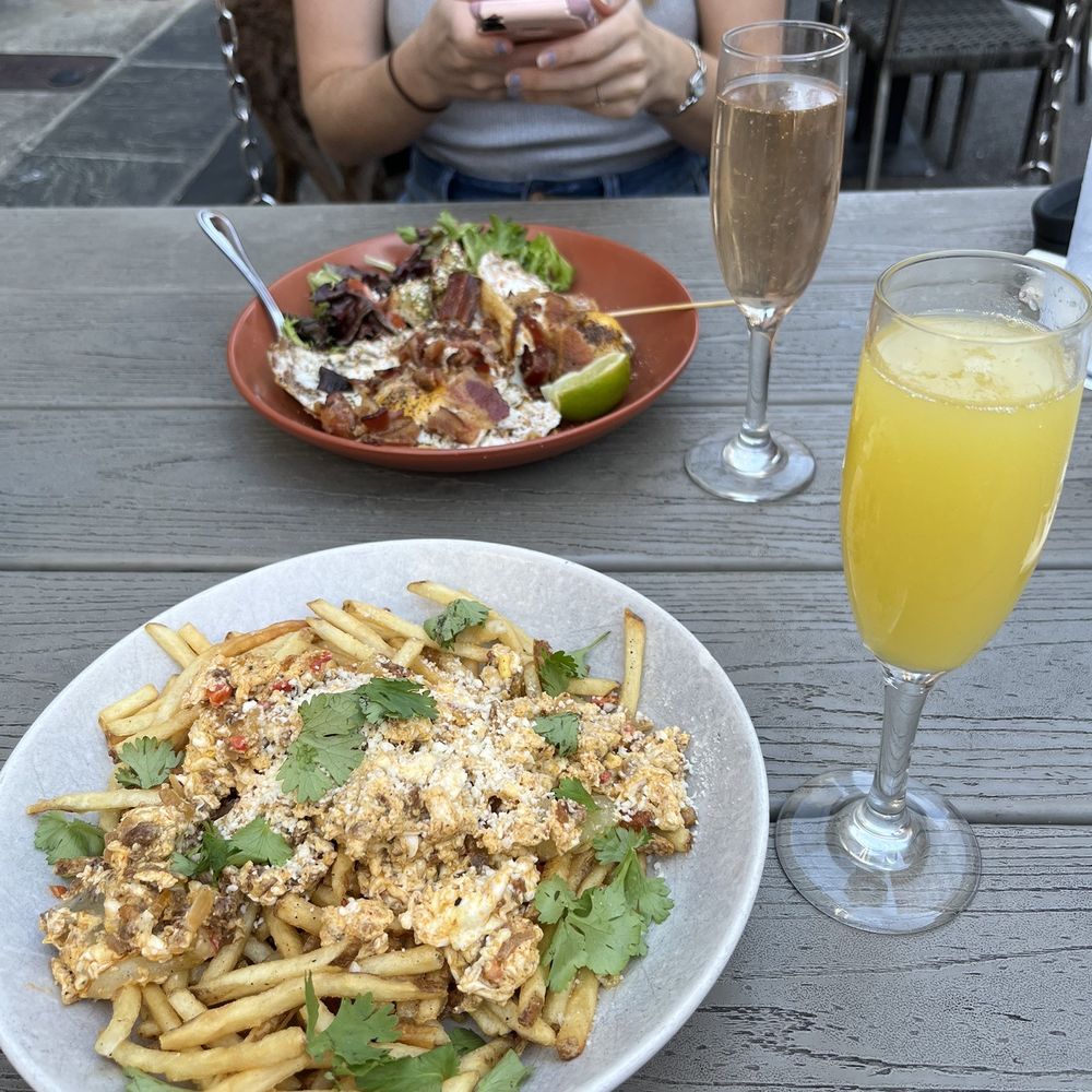 Squid Ink Eclectic Eats & Drinks - Spanish scramble, avocado toast, orange mimosa, strawberry mimosa - Gastropubs Near Me - Mobile, Alabama Squid Ink Eclectic Eats & Drinks - Spanish scramble, avocado toast, orange mimosa, strawberry mimosa - Gastropubs Near Me - Mobile, Alabama