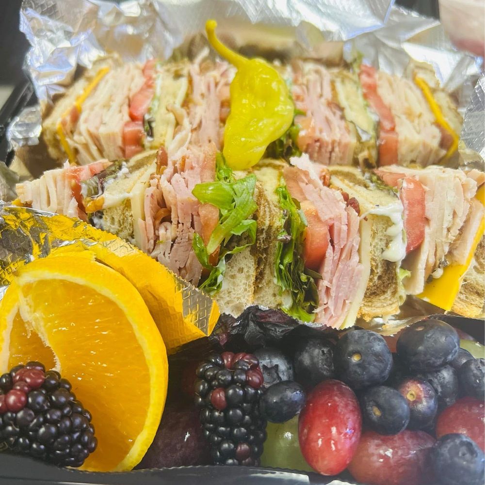 Club sandwich, mine looked like this, but with potato salad rather than fruit Club sandwich, mine looked like this, but with potato salad rather than fruit