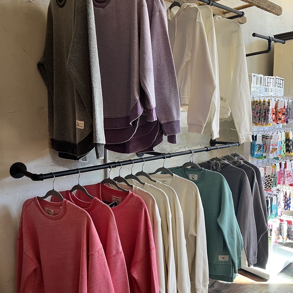 Imperial Mercantile - a variety of sweaters hanging on a rack - Flowers & Gifts Near Me - Kings Mountain, North Carolina