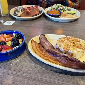 Snooze, an A.M. Eatery - Pancakes, bacon, hash brown, protein veggie egg white scramble with chicken sausage & side of fruit. - Breakfast & Brunch Near Me - Addison, Texas