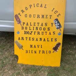 Tropical Ice Gourmet - Roadside signage: Tropical Ice Gourmet. Ice popsicles and "bolingos". 100% Fruit. Artisanal. Ice cold mavi.