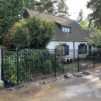 Verano Landscaping - a house with a gate and a sign that says school - Fences & Gates Near Me