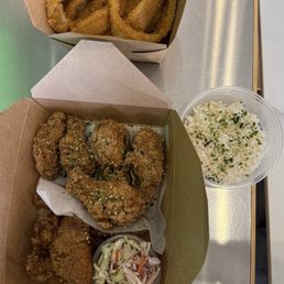 Breaded Onion Rings (not gluten-free), and two types of wings with slaw - garlic soy and Parmesan.