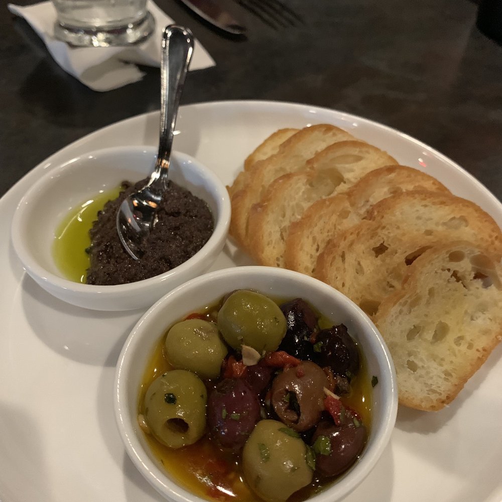 Costa Brava Bistro - Complimentary tapenade, olives, and crostinis. - Spanish Near Me - Bellaire, Texas