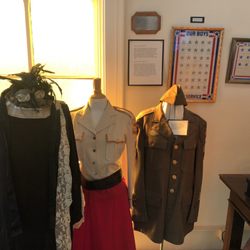 Williamsville Historical Society Museum - Some army uniforms, and a black dress.