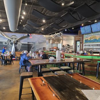 Flying Boat Tap Room - Cute restaurant with a plane flying through the wall. LOL - Pizza Near Me - Ocala, Florida