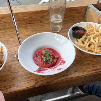 OB Brewery - Idk why this hummus was pink but it was delicious. Garlic fries. Pita bread not pictured. - Breweries Near Me - San Diego, California OB Brewery - Idk why this hummus was pink but it was delicious. Garlic fries. Pita bread not pictured. - Breweries Near Me - San Diego, California
