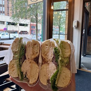 Water Street Bagel - Bagel with Water Street Bagel sign - Bagels Near Me - Syracuse, New York