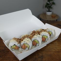 Salmon roll with jalapeños mayo and crispy onions