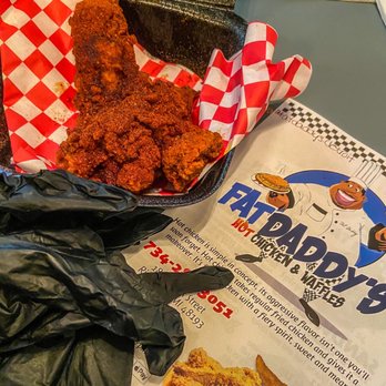 Fat Daddy's Hot Chicken & Waffles - X Hot Too Damn Hot Chicken Tender with gloves. - Waffles Near Me - Riverview, Michigan Fat Daddy's Hot Chicken & Waffles - X Hot Too Damn Hot Chicken Tender with gloves. - Waffles Near Me - Riverview, Michigan