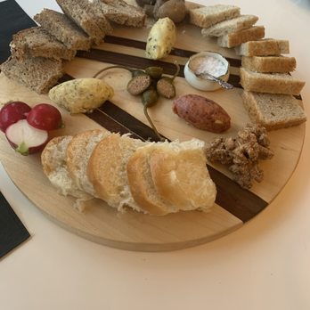 VIM Dining & Desserts - Cultured butter plate with herb butter, strawberry butter, and olive butter, caperberries, radishes, mushrooms and spiced walnuts - New American Near Me - Santa Cruz, California