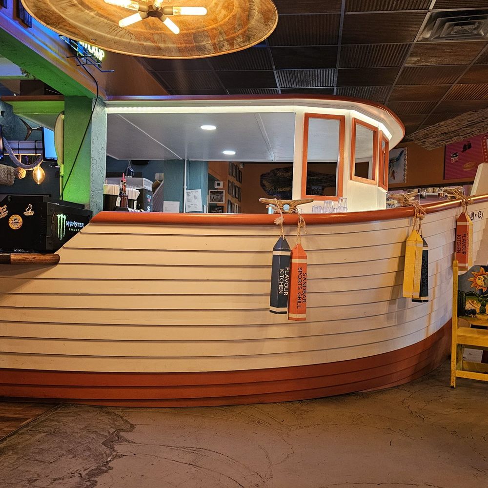 Cocoa Beach Fish Camp Grill - The boat-shaped bar - New American Near Me - Cocoa Beach, Florida Cocoa Beach Fish Camp Grill - The boat-shaped bar - New American Near Me - Cocoa Beach, Florida