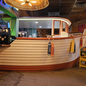 Cocoa Beach Fish Camp Grill - The boat-shaped bar - New American Near Me - Cocoa Beach, Florida Cocoa Beach Fish Camp Grill - The boat-shaped bar - New American Near Me - Cocoa Beach, Florida