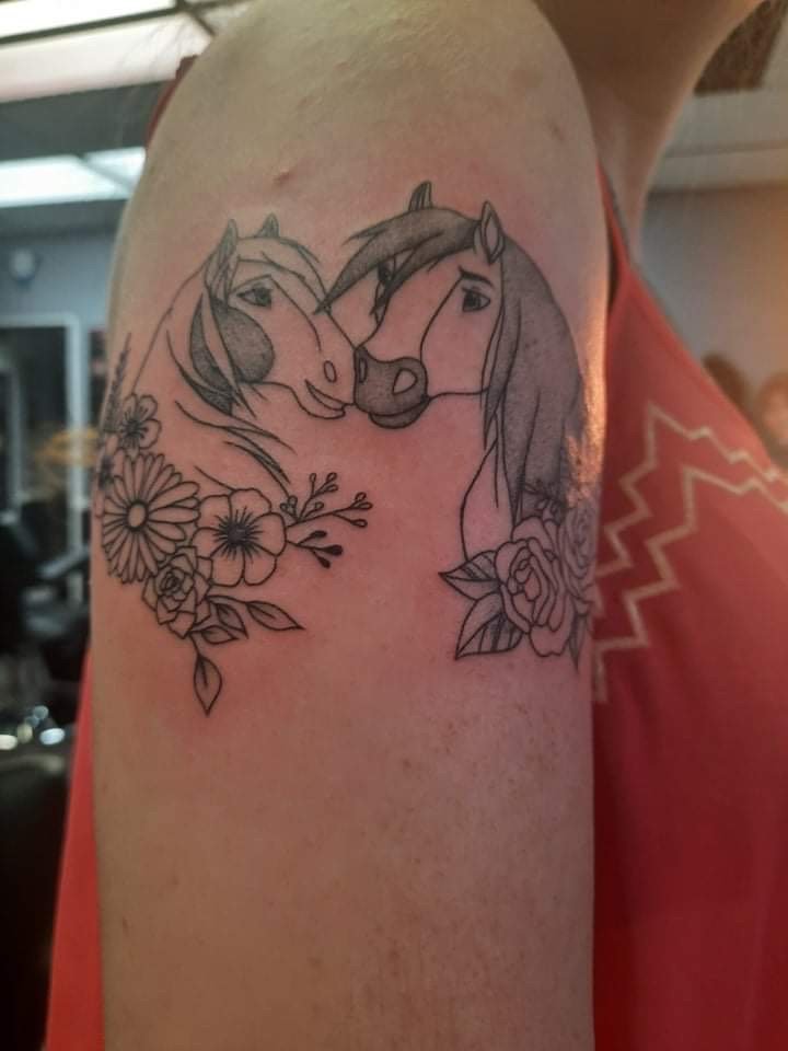 Permanent Images Tattoo & Body Piercing Logo