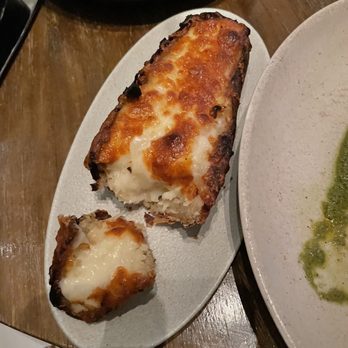 Fish By Jose Andres - Twice Baked Potato .. the skin was burnt. - Seafood Near Me - Paradise Island, Florida Fish By Jose Andres - Twice Baked Potato .. the skin was burnt. - Seafood Near Me - Paradise Island, Florida