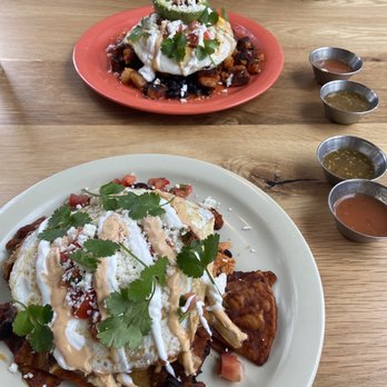Otra Vez - Chilaquiles (white plate) Rancheros (red plate) - Breakfast & Brunch Near Me - Camas, Washington Otra Vez - Chilaquiles (white plate) Rancheros (red plate) - Breakfast & Brunch Near Me - Camas, Washington